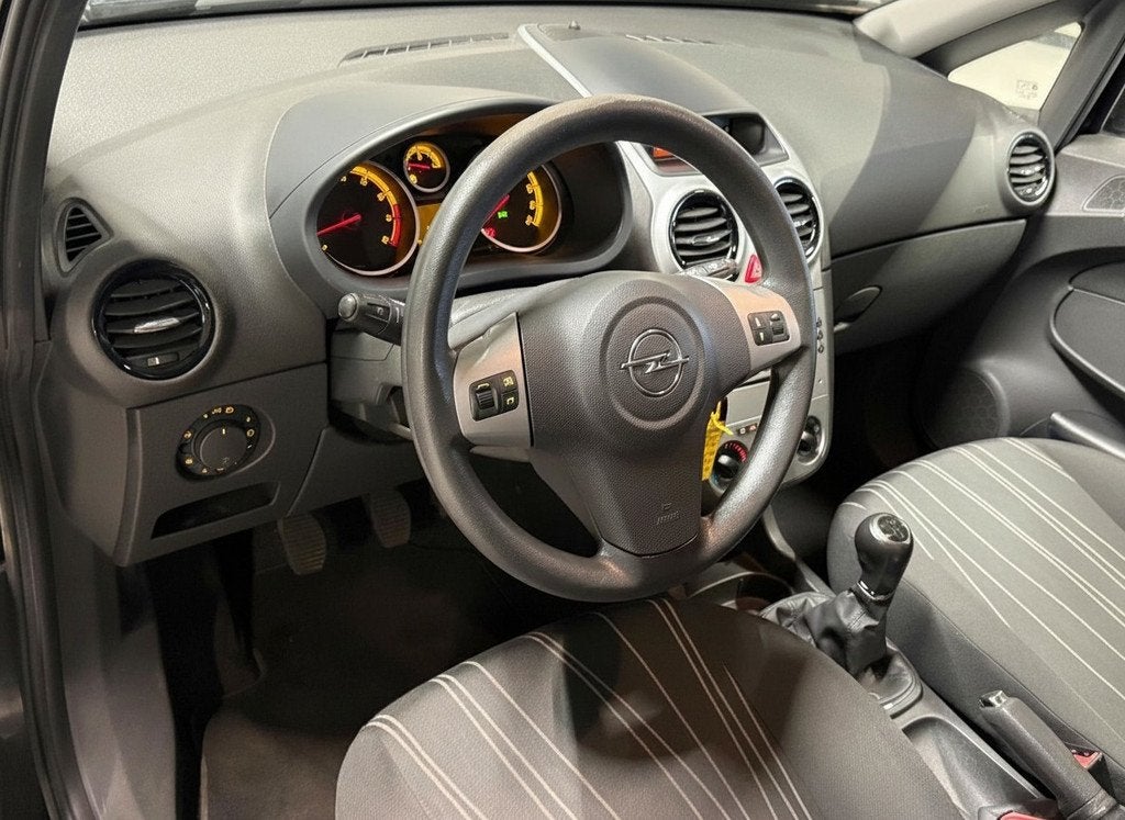 Opel Corsa 1.4-16V 90PK Enjoy Airco|CruiseControl!, Voorwielaandrijving, Gebruikt, Zwart, 4 cilinders