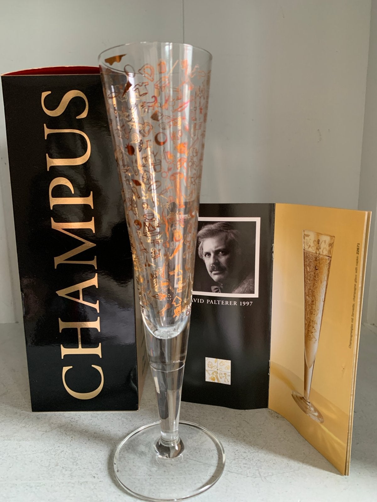 Ritzenhoff Champagneglas David Palterer 1997 met Boek, Antiek en Kunst, Ophalen of Verzenden