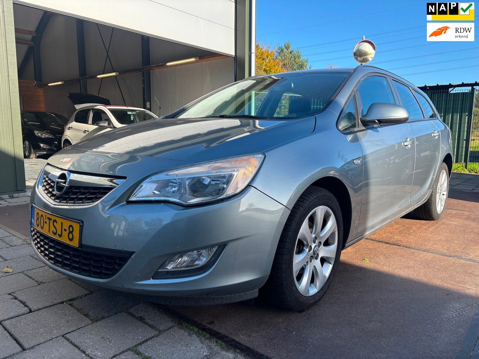 Opel Astra Sports Tourer 1.4 Turbo Edition Airco Navi Cruise, Auto's, Voorwielaandrijving, Euro 5, Gebruikt, Verwarmde buitenspiegels