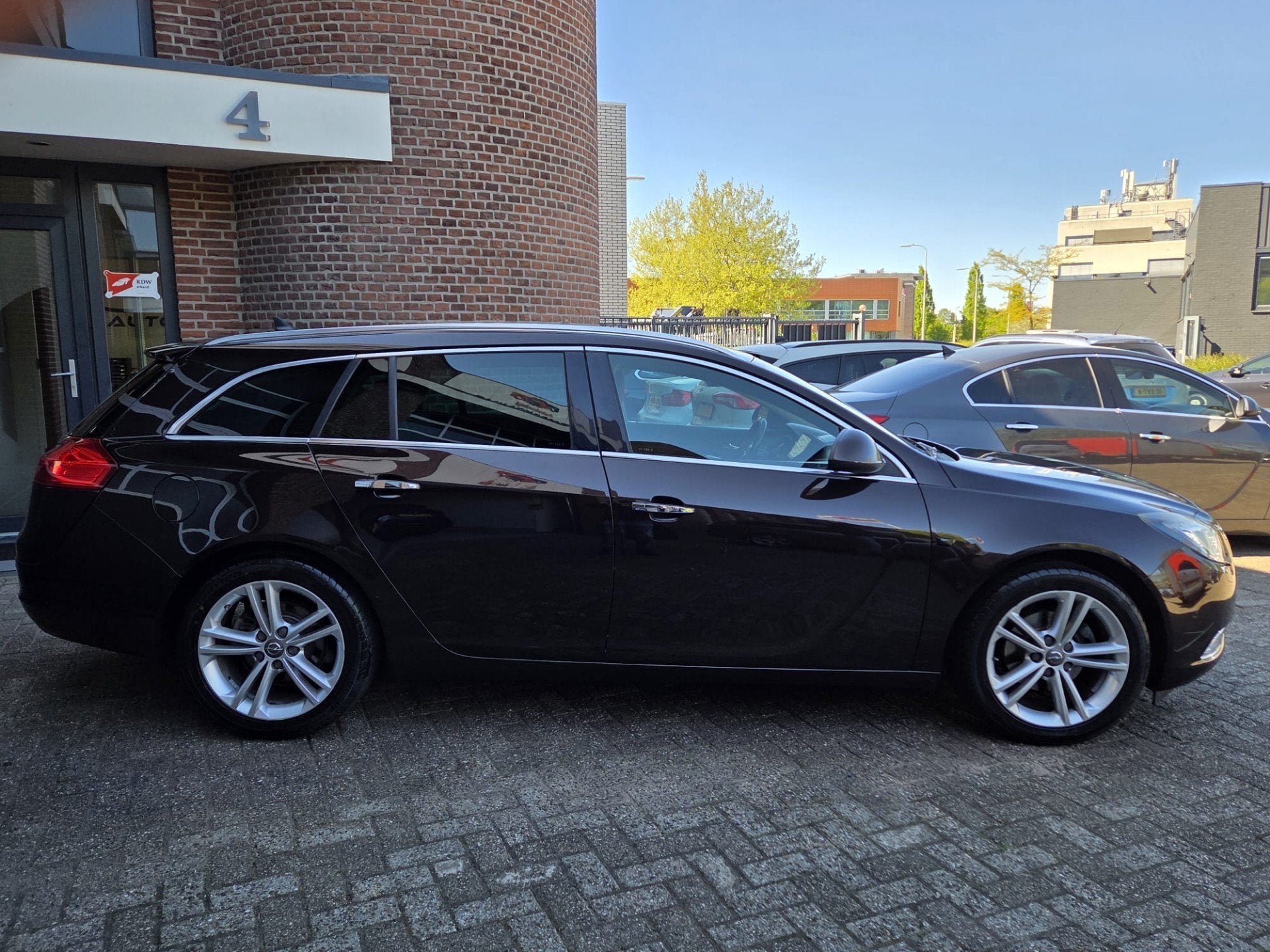 Opel Insignia Sports Tourer 1.4 Turbo EcoFLEX Cosmo | PDC |, Auto's, Opel, Euro 5, 4 cilinders, Bruin, Leder en Stof