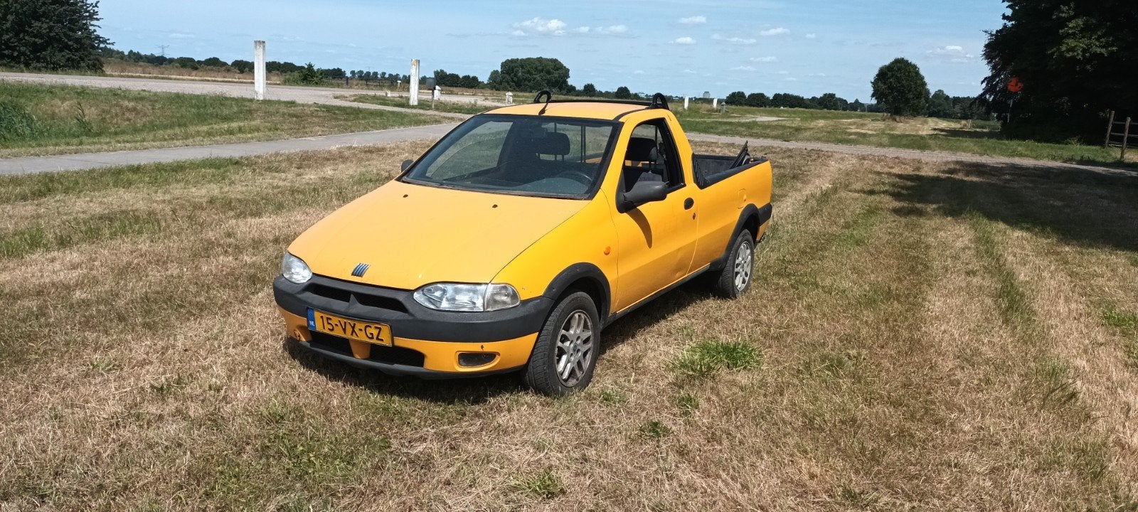 Te koop Fiat Strada pickup 1.7TD, Auto's, Fiat, Voorwielaandrijving, 4 cilinders, Geel, Grijs