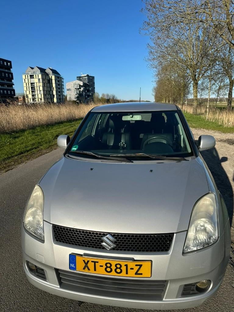 Suzuki Swift 1.3 5DRS 2007 Grijs, Auto's, Voorwielaandrijving, 40 €/maand, Zwart, 965 kg