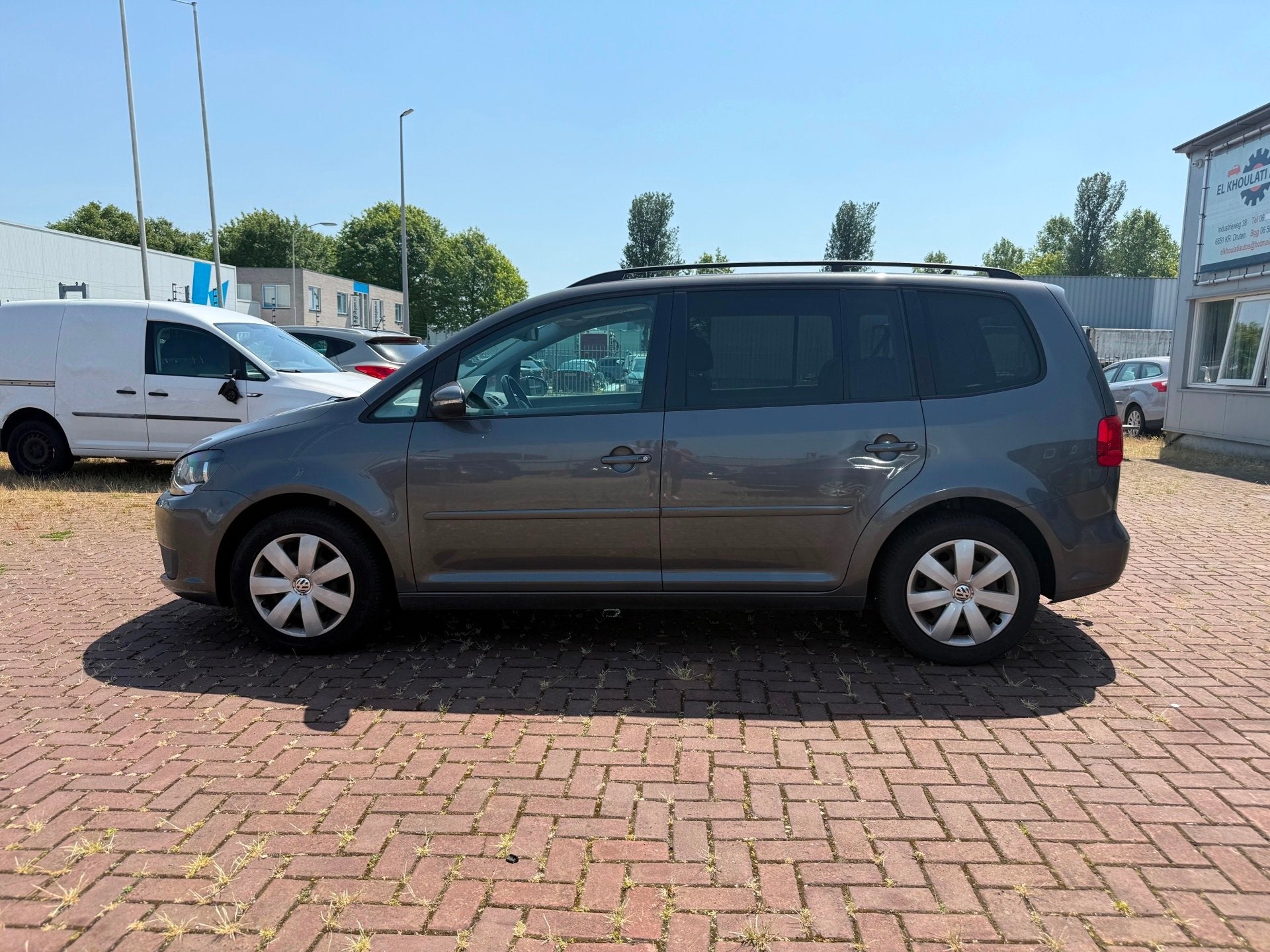 Volkswagen Touran 1.2 TSI Comfortline BlueMotion Export, Auto's, Volkswagen, Euro 5, Gebruikt, Zwart, 4 cilinders