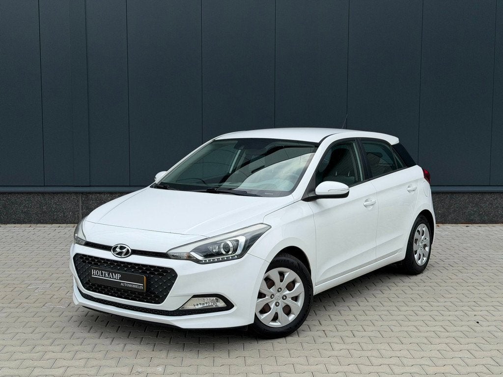 Hyundai I20 1.2 HP i-Motion | CRUISE | AIRCO | BLUETOOTH, Stof, Zwart, 4 cilinders, Wit