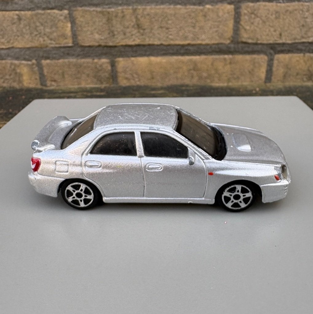 Burago Subaru Impreza WRX STI  1:43, Ophalen of Verzenden, Gebruikt, Auto