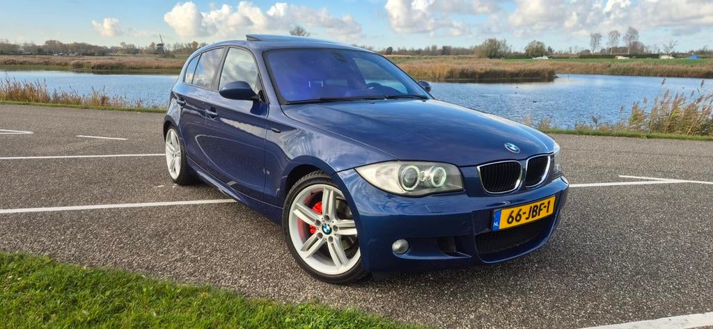 BMW 1-Serie 2.0 118I 5DR AUT 2009 Blauw, Auto's, Achterwielaandrijving, 1995 cc, Zwart, Blauw