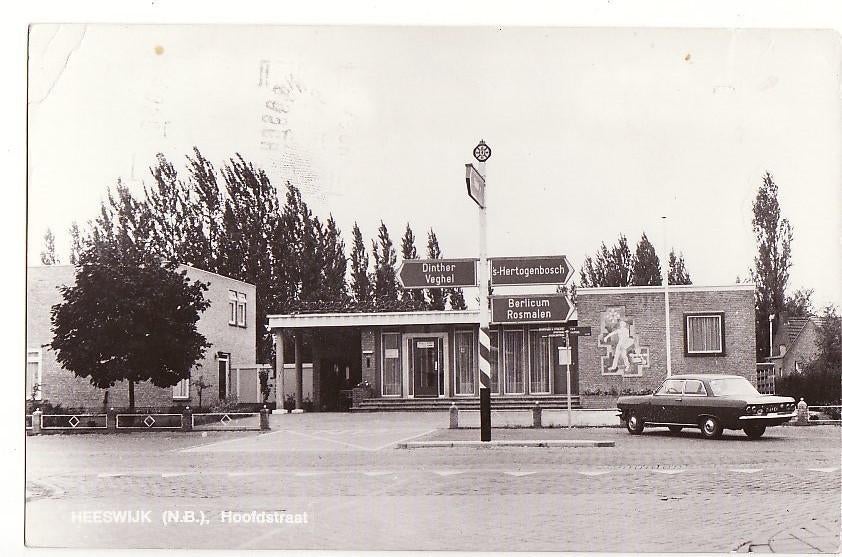 Heeswijk hoofdstraat 1973 met ANWB Wegwijzer & Taunus (?, Verzenden, 1960 tot 1980, Gelopen, Noord-Brabant