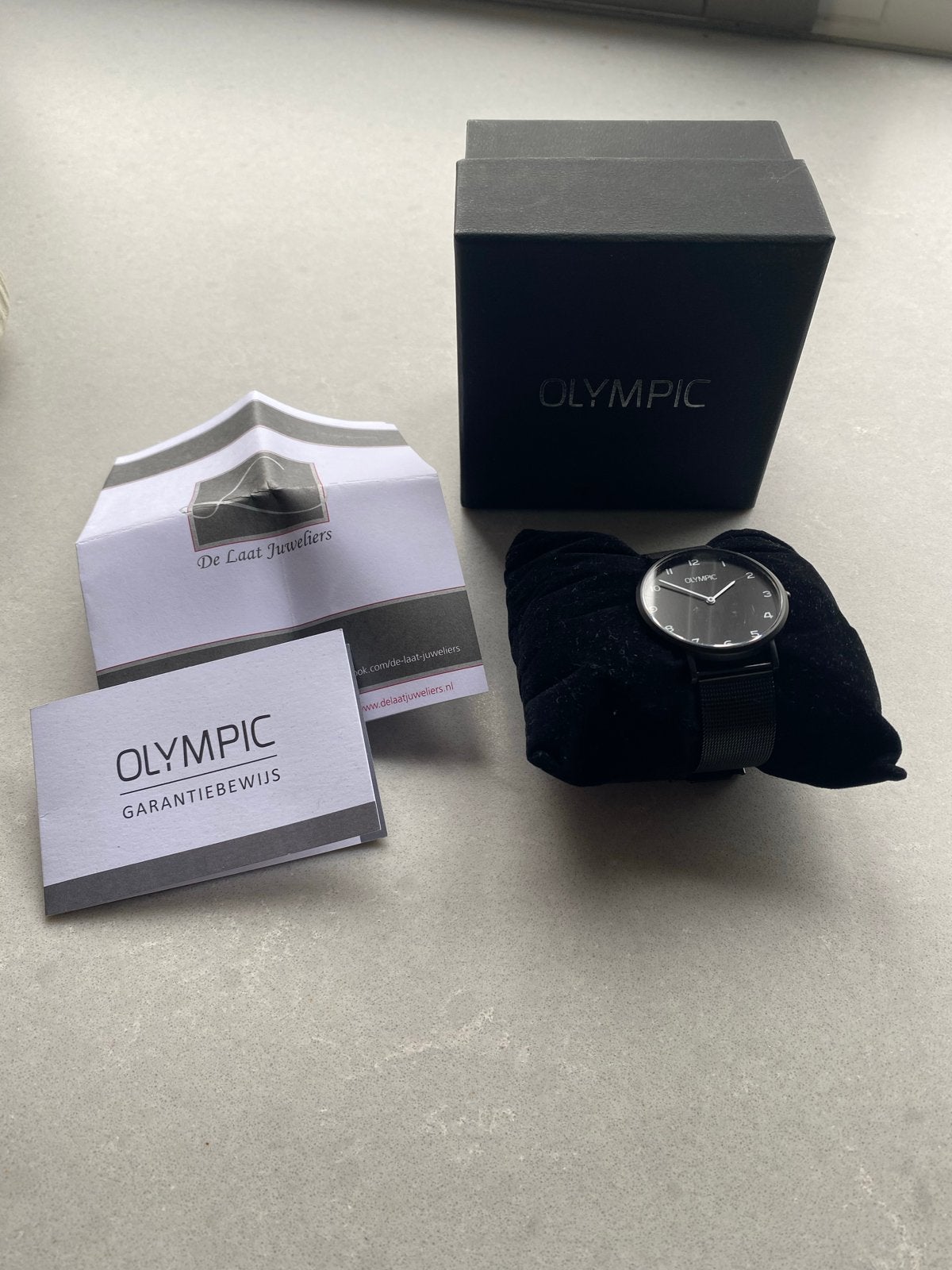 Olympic horloge met garantiebewijs en doos, Ophalen, Zo goed als nieuw