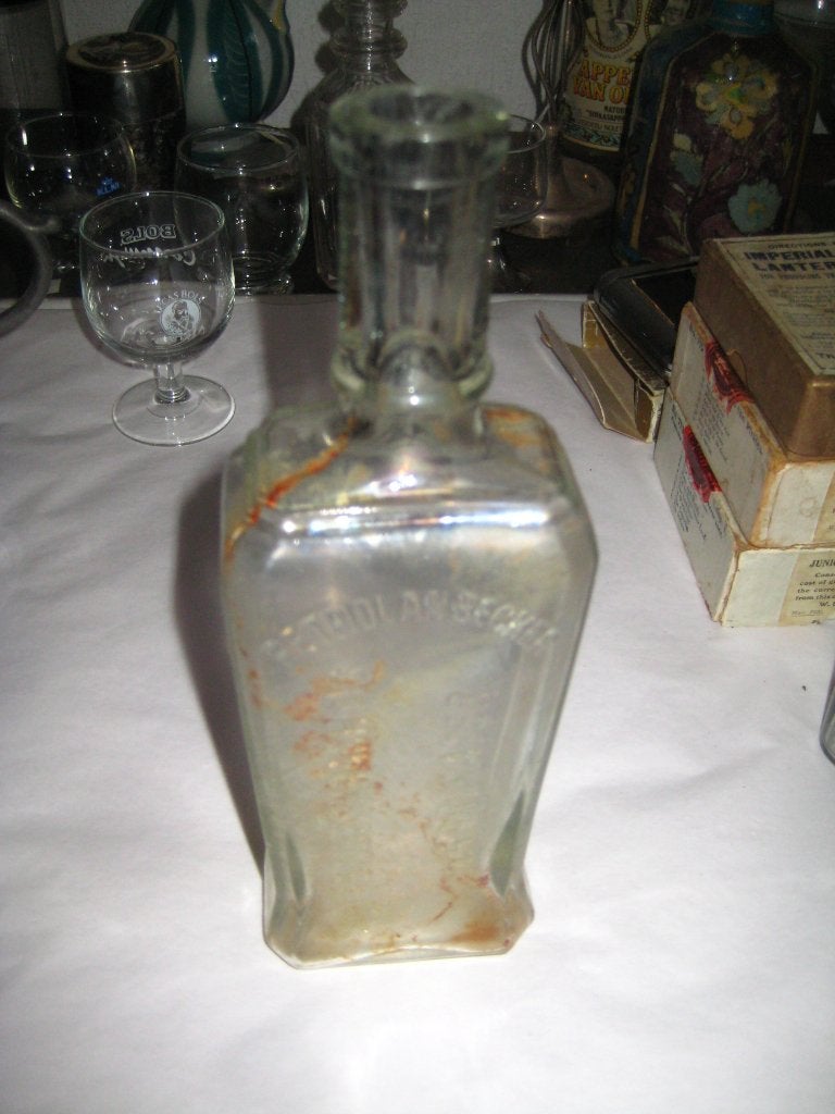oude fles geneeskrachtig haarwater - petrolanbecker, Ophalen of Verzenden