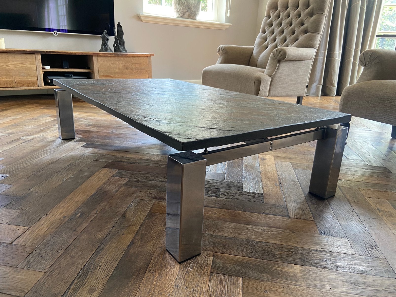 Design salontafel natuurstenen blad met een RVS onderstel, Huis en Inrichting, Tafels | Salontafels, 100 tot 150 cm, Zo goed als nieuw