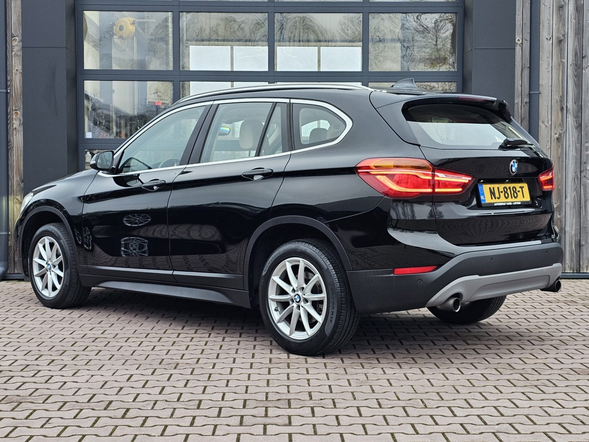 BMW X1 sDrive20i Centennial High Executive | Automaat | Navi, Auto's, BMW, 1998 cc, Euro 6, Met garantie (alle), Zwart
