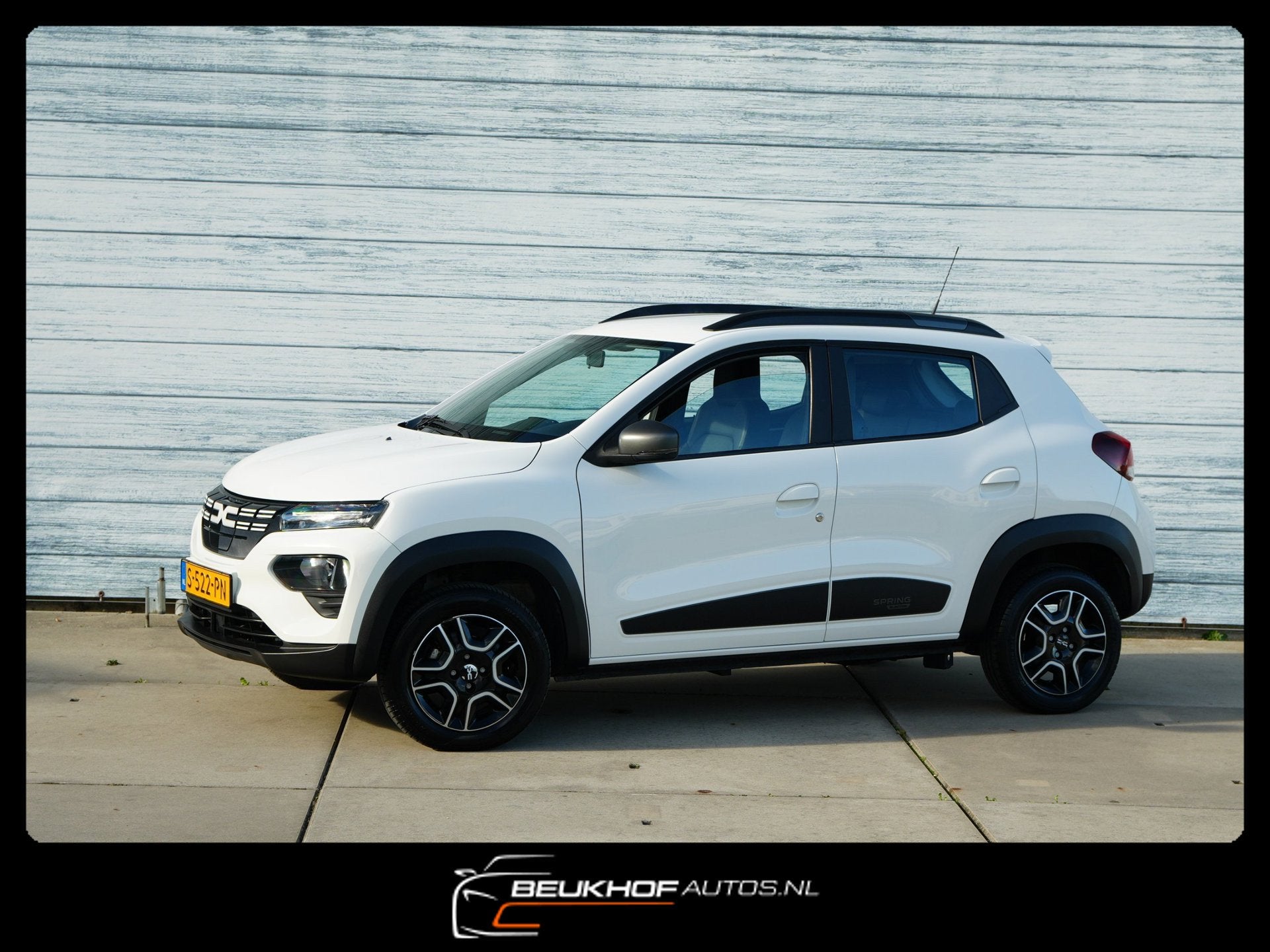 Dacia Spring Expression 27 kWh Camera Leer Navi Soh 91.5%, Auto's, Dealer onderhouden, Gebruikt, Zwart, 38 min