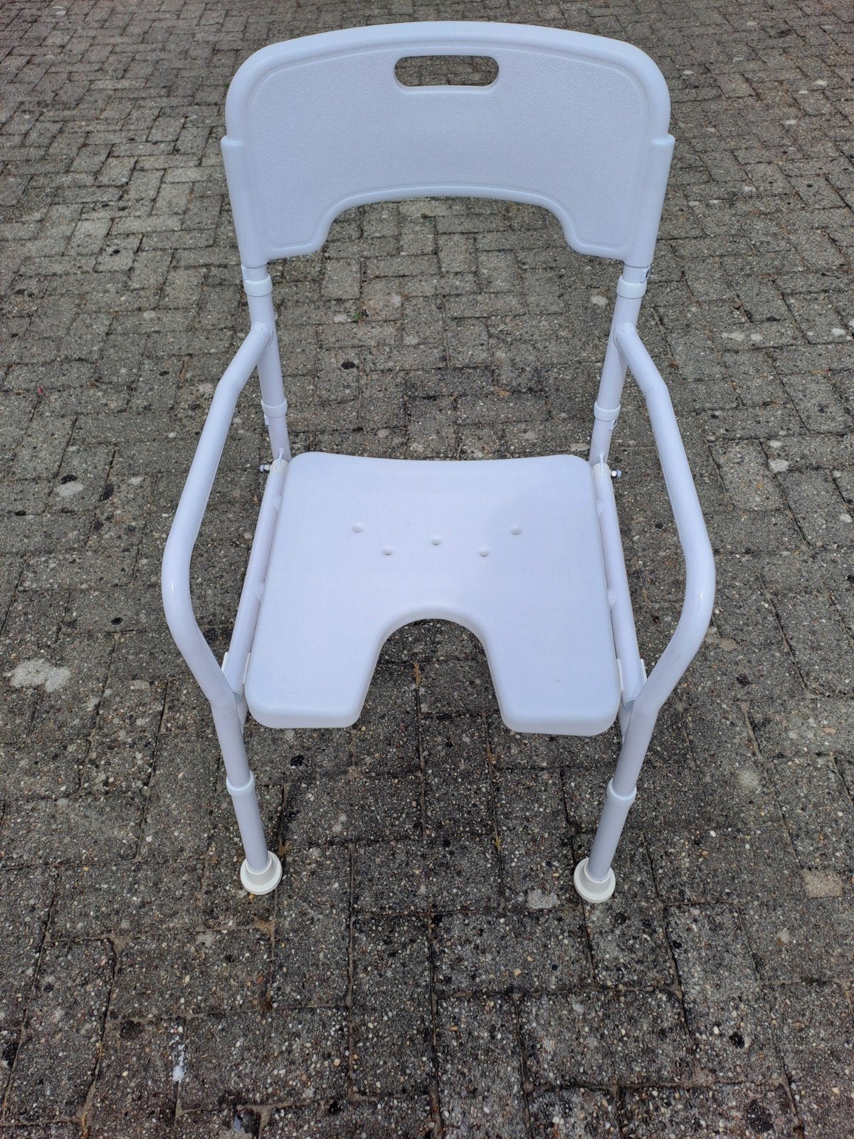 douchestoel., Ophalen