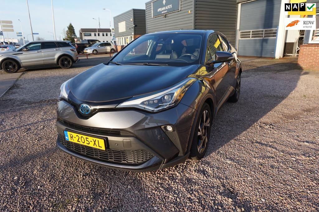 Toyota C-HR 1.8 Hybrid Style, 12-22 , nieuwstaat org Ned , N, Auto's, Toyota, Euro 6, 4 cilinders, Grijs, Hybride Elektrisch/Benzine