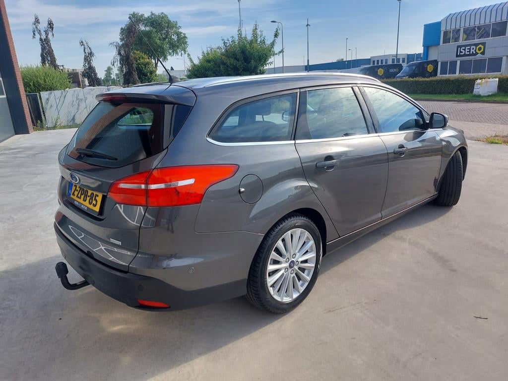 Ford Focus Wagon 1.0 Titanium Edition Airco/ECC/LMV/NAV, Gebruikt, Origineel Nederlands, Handgeschakeld, 1216 kg