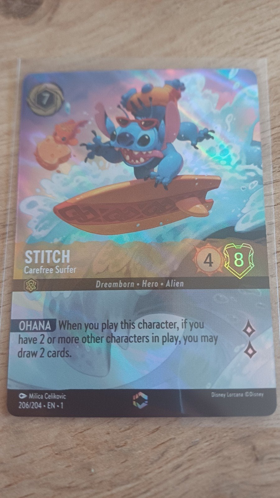 Disney Lorcana Stitch - Carefree Surfer Enchanted Foil, Ophalen of Verzenden, Zo goed als nieuw, Losse kaart, Foil