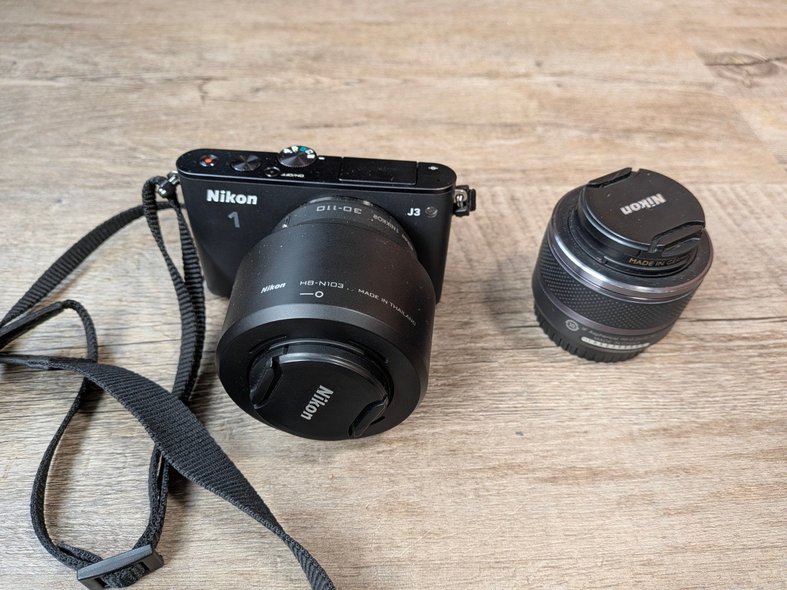 Nikon 1 J3 met 1 Nikkor 10-30mm en 30-110mm lenzen, Gebruikt, Ophalen of Verzenden, Nikon, Draagriem