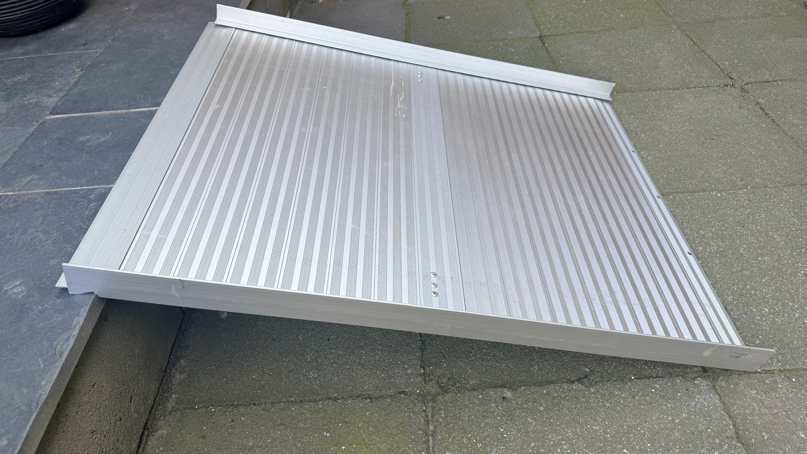 Oprolbare oprijplaat, Ophalen, Zo goed als nieuw