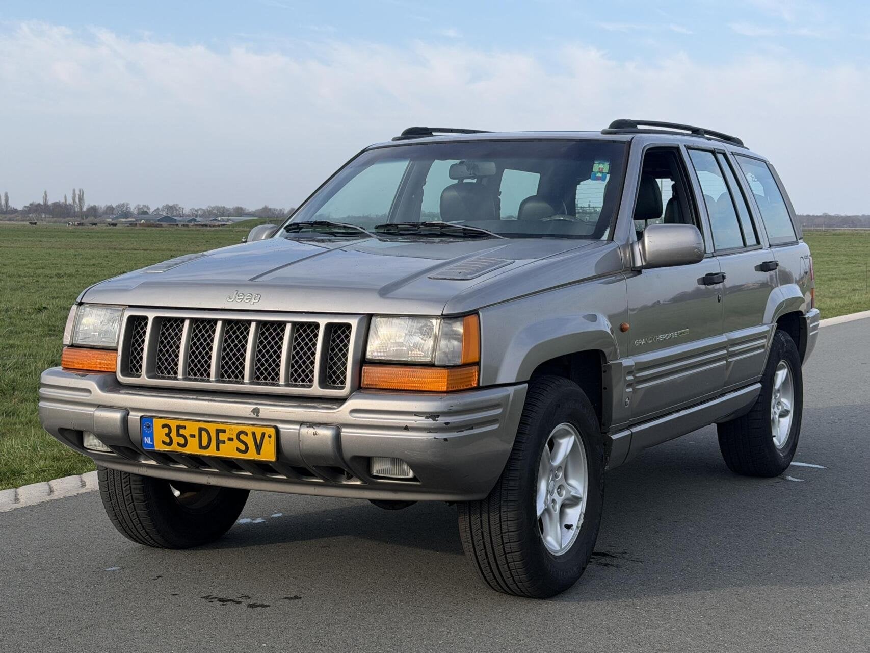 Jeep Grand Cherokee 5.9i V8 LX Limited Edition, Auto's, Gebruikt, 8 cilinders, Lederen bekleding, 120 €/maand