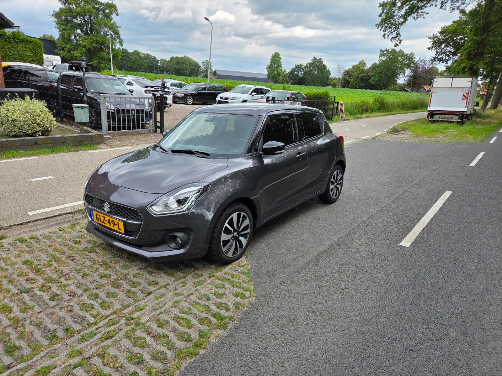 Suzuki Swift 1.0 Boosterjet 112pk Automaat 2019 Grijs, Auto's, Stof, Zwart, 400 kg, Swift