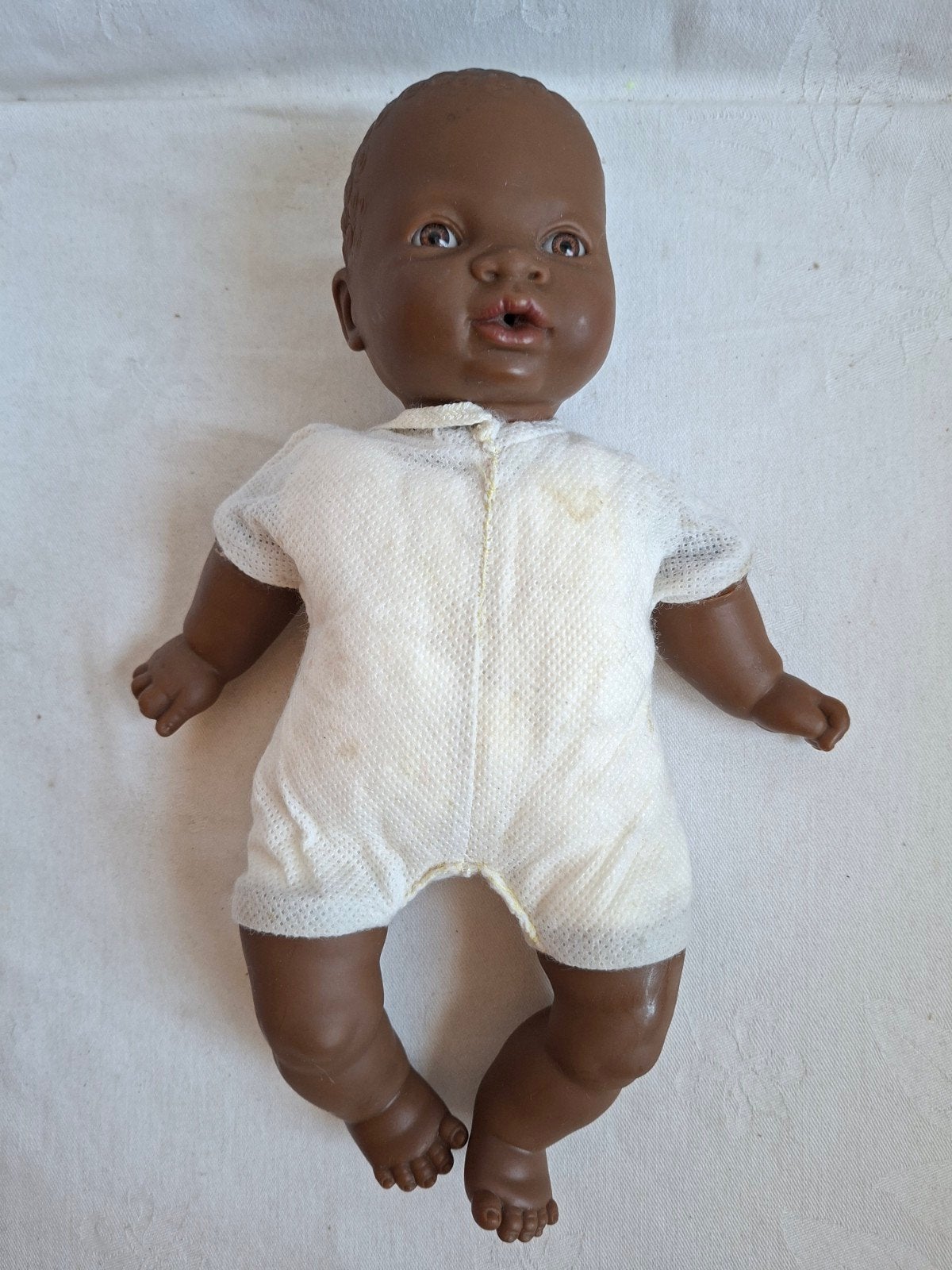 Antonio Juan bruine Babypop pop getint donker 28 cm, Ophalen of Verzenden, Pop, Levensecht of Reborn