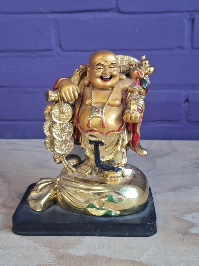 Feng Shui-beeldje van een lachende Boeddha, Ophalen