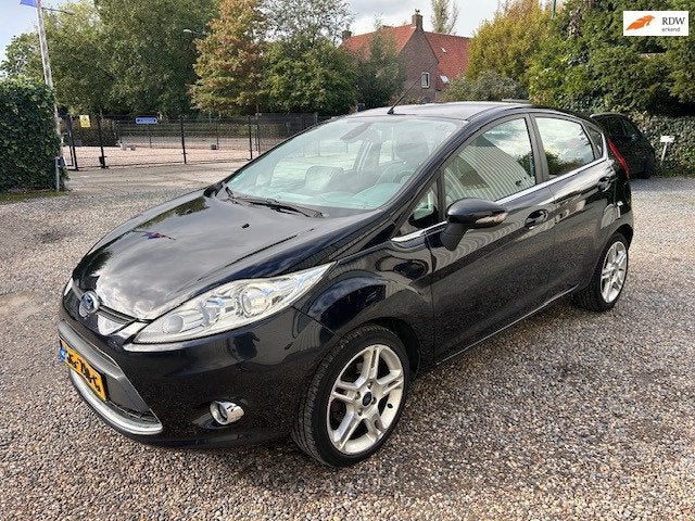 Ford Fiesta 1.4 Ghia NAVI! STOEL-VRWRM, Voorwielaandrijving, Euro 5, Verwarmde buitenspiegels, Zwart