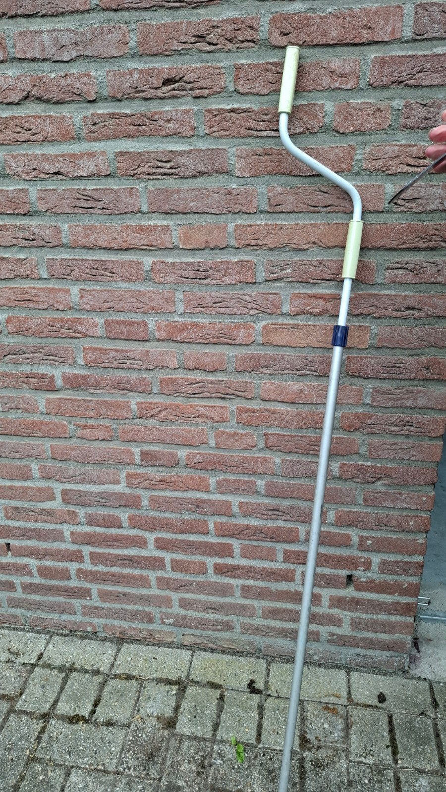 Stang voor opdraaien van luifel, Ophalen