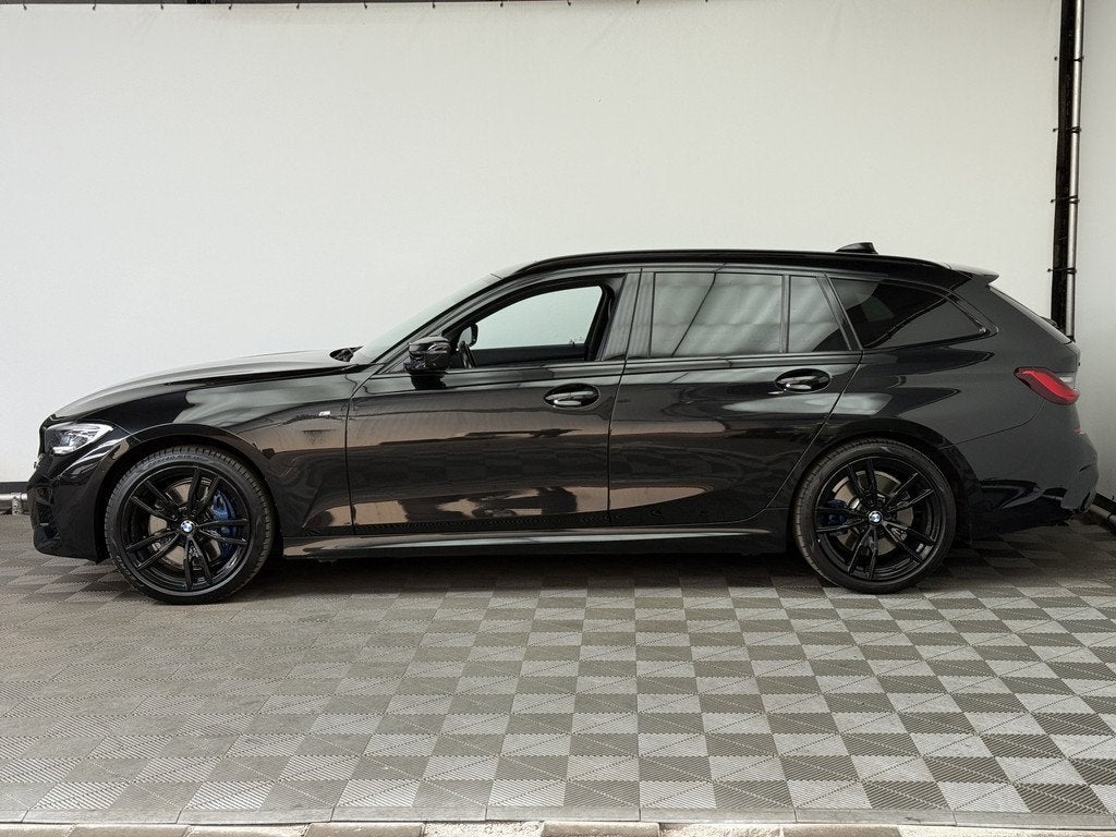 BMW 3 Serie Touring M340i xDrive High Executive Zeer Complet, Auto's, BMW, 1780 kg, Met garantie (alle), Zwart, Leder