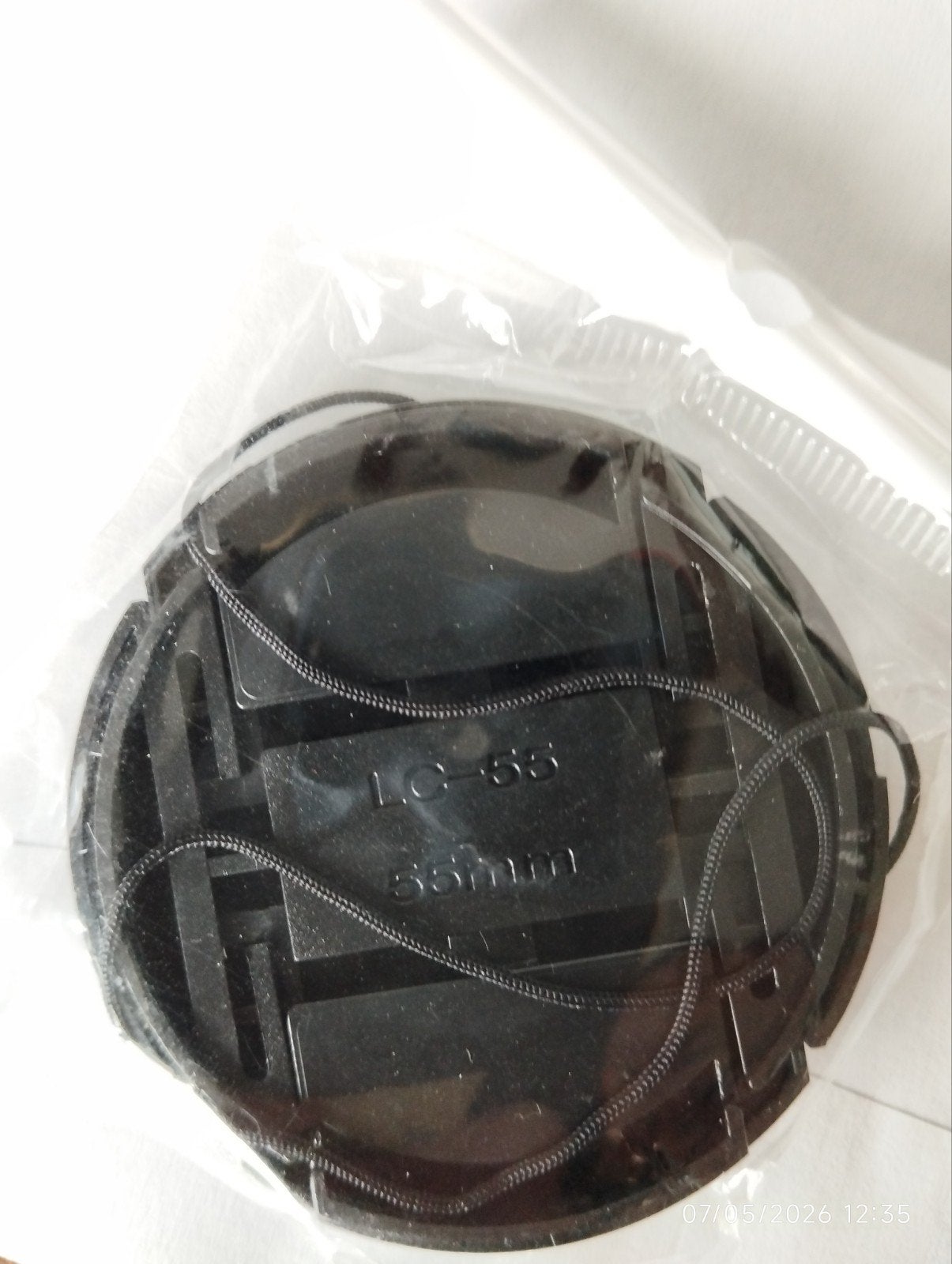 Lensdop 55mm met koordje - Nieuw in verpakking, Ophalen of Verzenden, Nieuw, Toebehoren, Lensdoppen