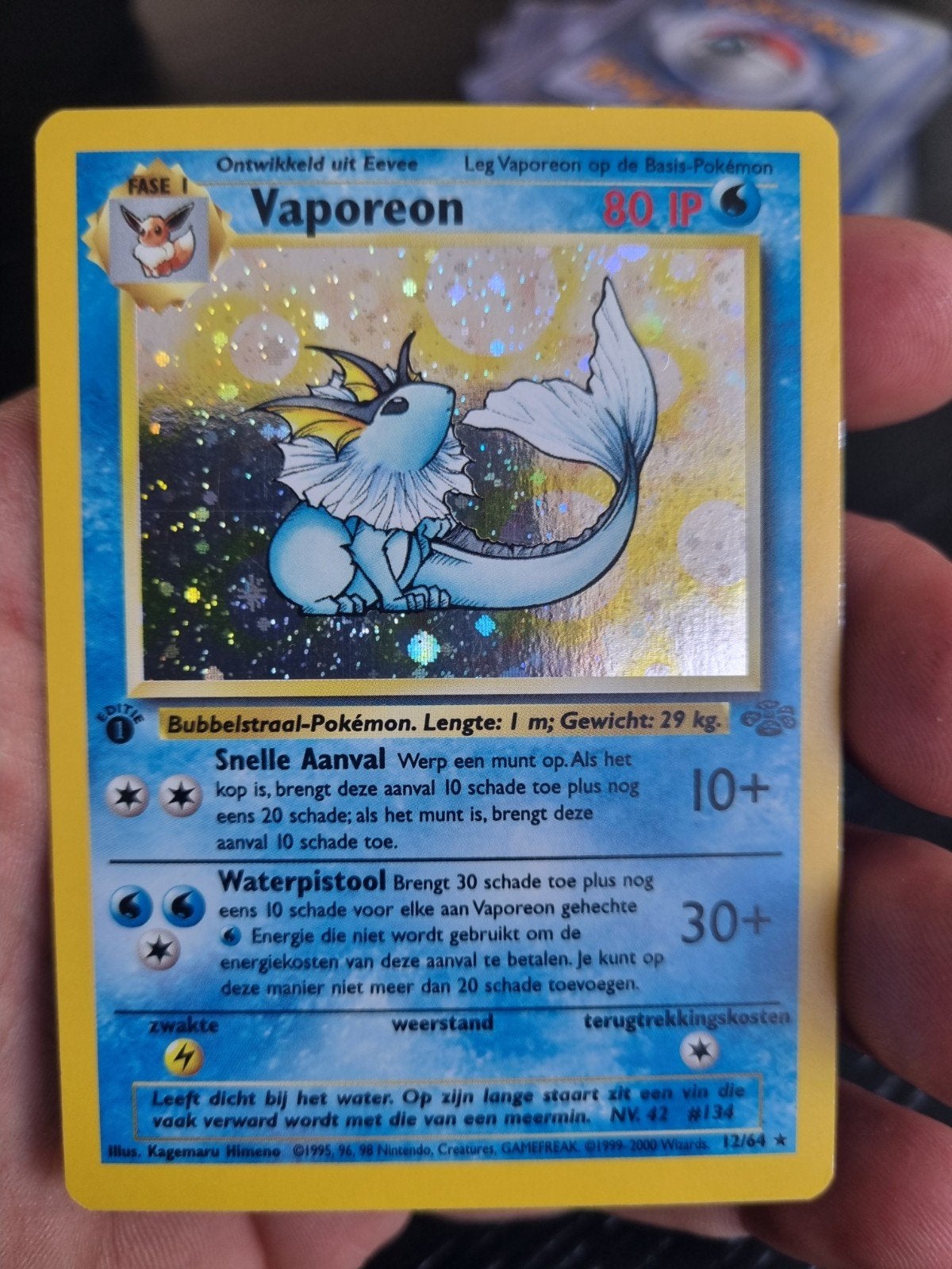 Vaporeon 12/64 jungle NL 1e editie , holo rare * € 55, Ophalen of Verzenden, Zo goed als nieuw, Losse kaart, Foil