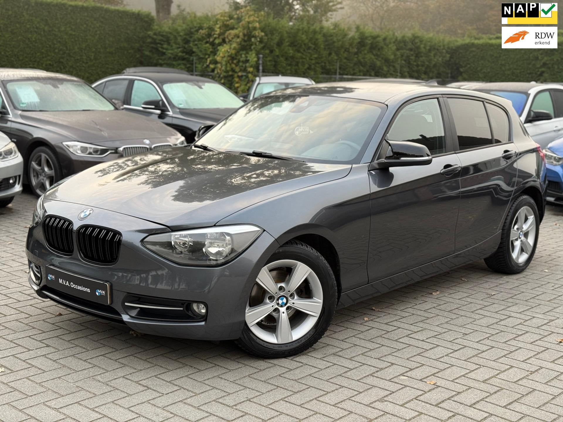 BMW 1-serie 116i Business+ Sport|Nieuwe Ketting + Klepseals|, Auto's, 1-Serie, Euro 5, Gebruikt, Zwart