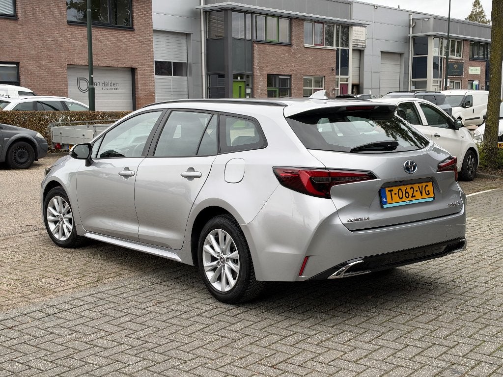Toyota Corolla TS Hybrid 140 Active | FACELIFT, Auto's, 4 cilinders, Verwarmde buitenspiegels, Corolla, Hybride Elektrisch/Benzine