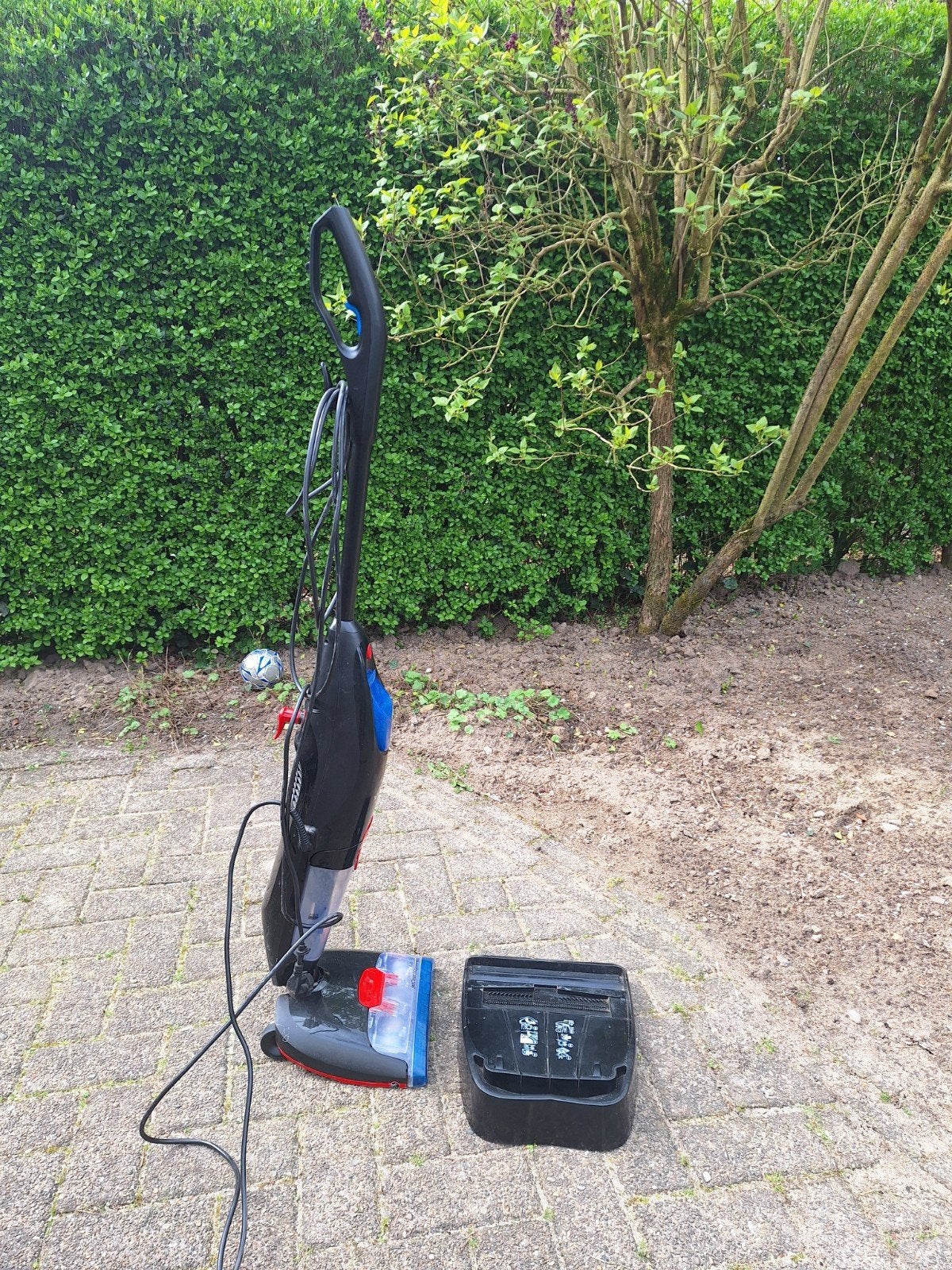 Schobmachine met waterreservoir., Ophalen