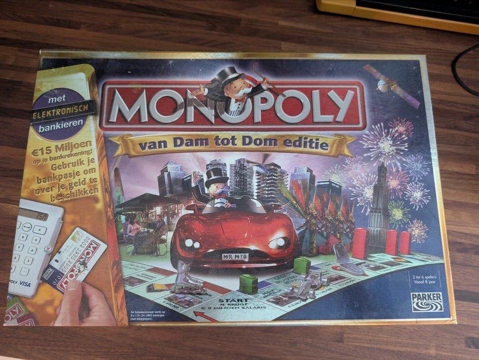 Monopoly van Dam tot Dom editie met elektronisch bankieren, Drie of vier spelers, Ophalen of Verzenden, Zo goed als nieuw, Parker