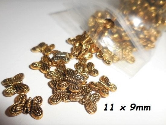 Goudkleurig Vlinders Metaal Kralen. 11 x 9mm, Ophalen of Verzenden, Nieuw, Kraal