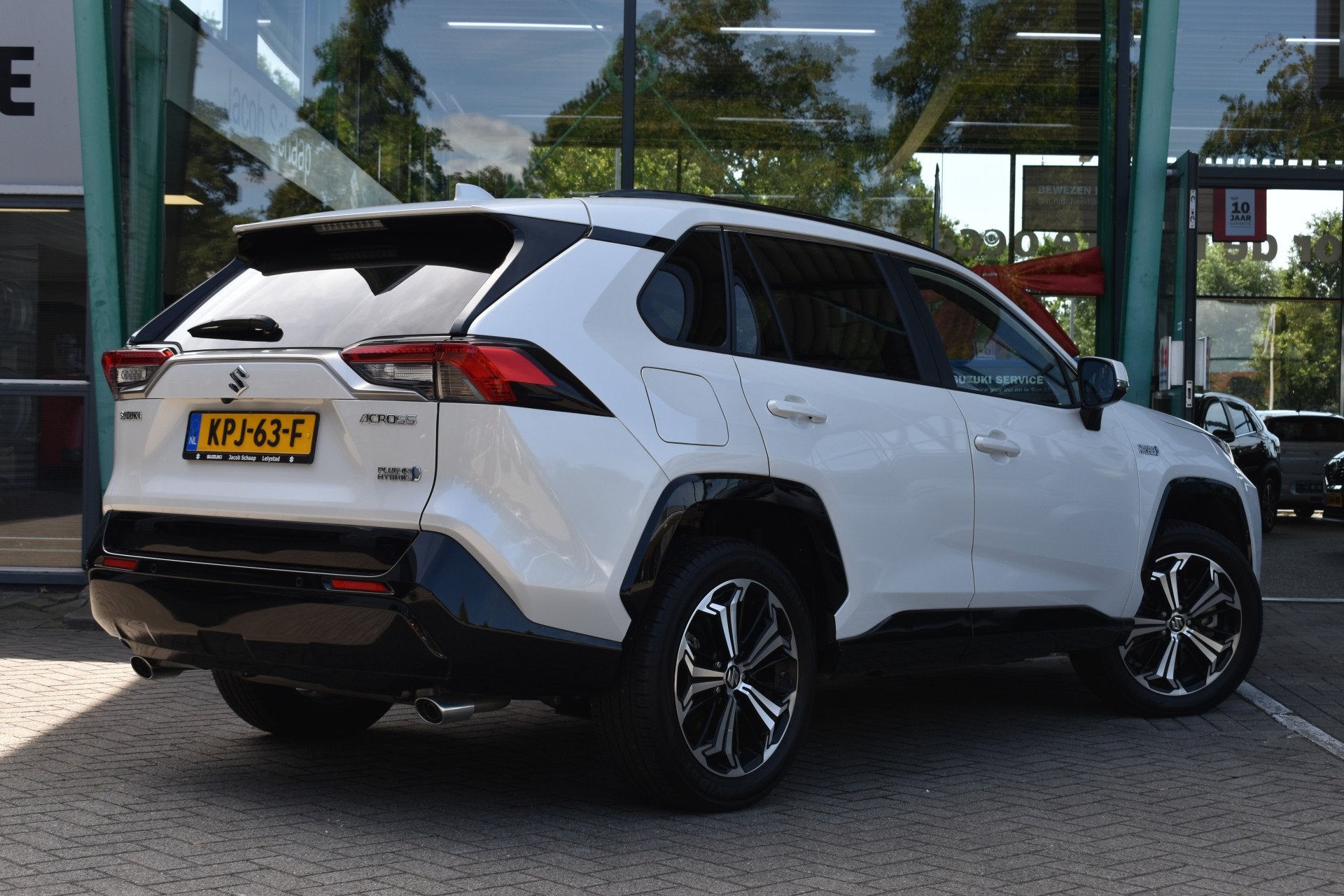 Toyota RAV4 (Suzuki) 2.5 Plug-in Hybrid AWD Style Limited Au, Zwart, 4 cilinders, Leder en Stof, Wit