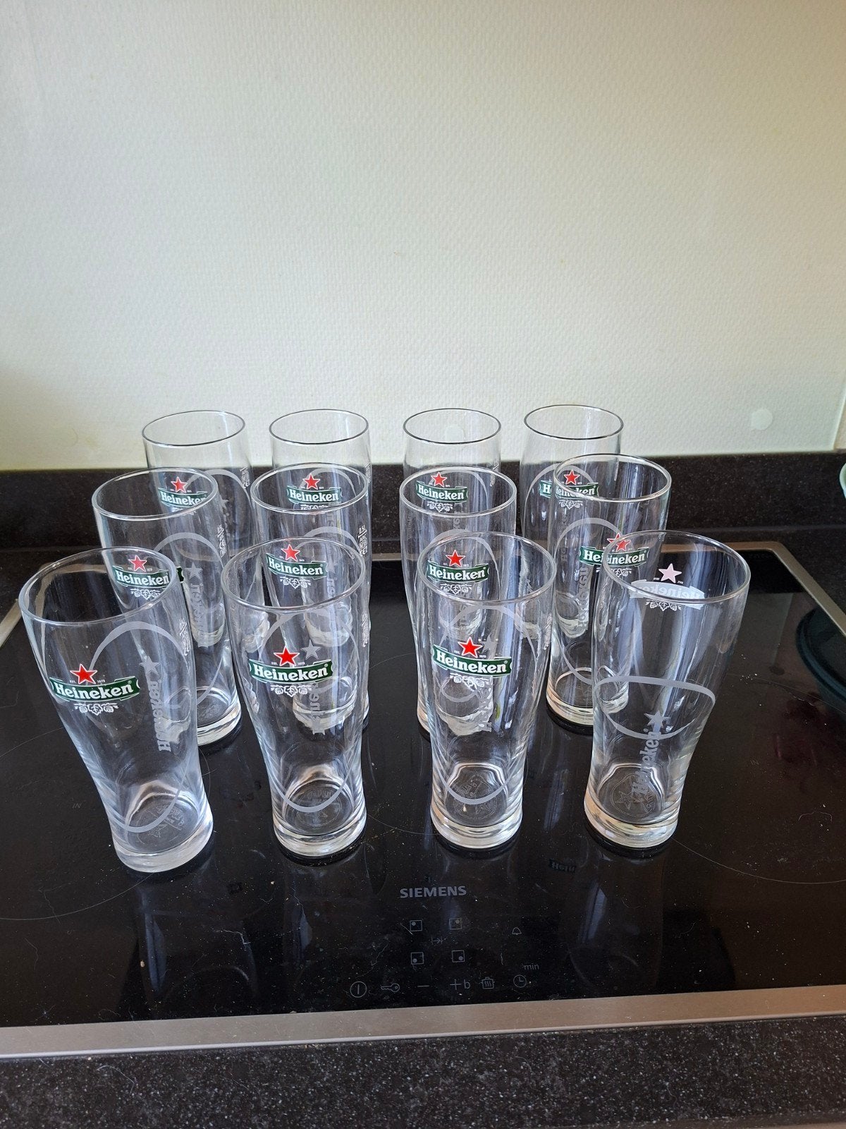 12 Heineken glazen, Verzamelen, Glas en Borrelglaasjes, Ophalen of Verzenden, Zo goed als nieuw, Bierglas