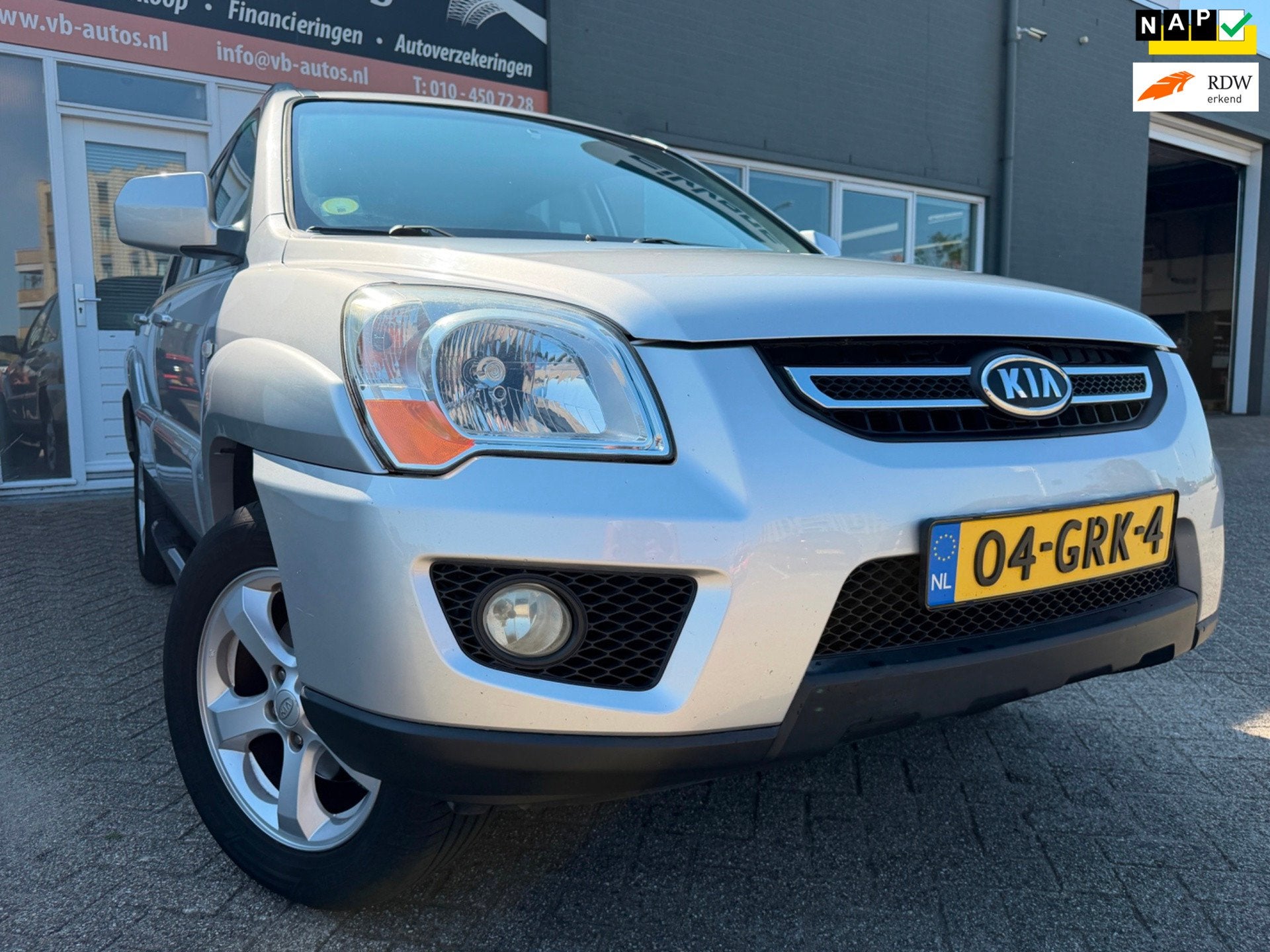 Kia Sportage 2.0 CVVT X-tra met trekhaak en cruise controle, Auto's, 1442 kg, Stof, Gebruikt, Zwart