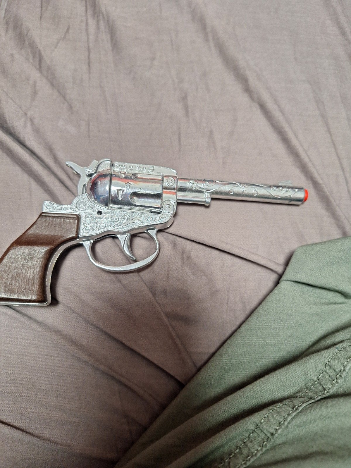 cowboy revolver MET ORANJE DOPJE, Ophalen of Verzenden, Zo goed als nieuw