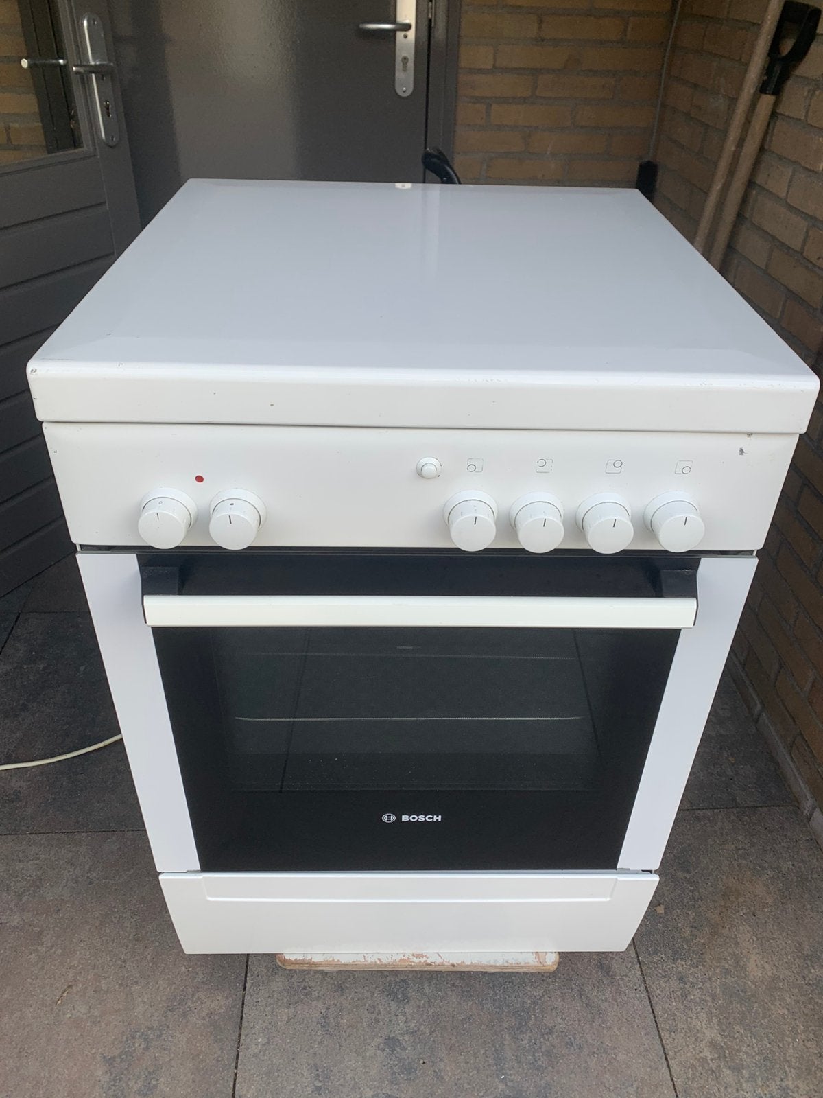 Bosch gasfornuis met vier pits, Zo goed als nieuw, Gas, Vrijstaand, 85 tot 90 cm