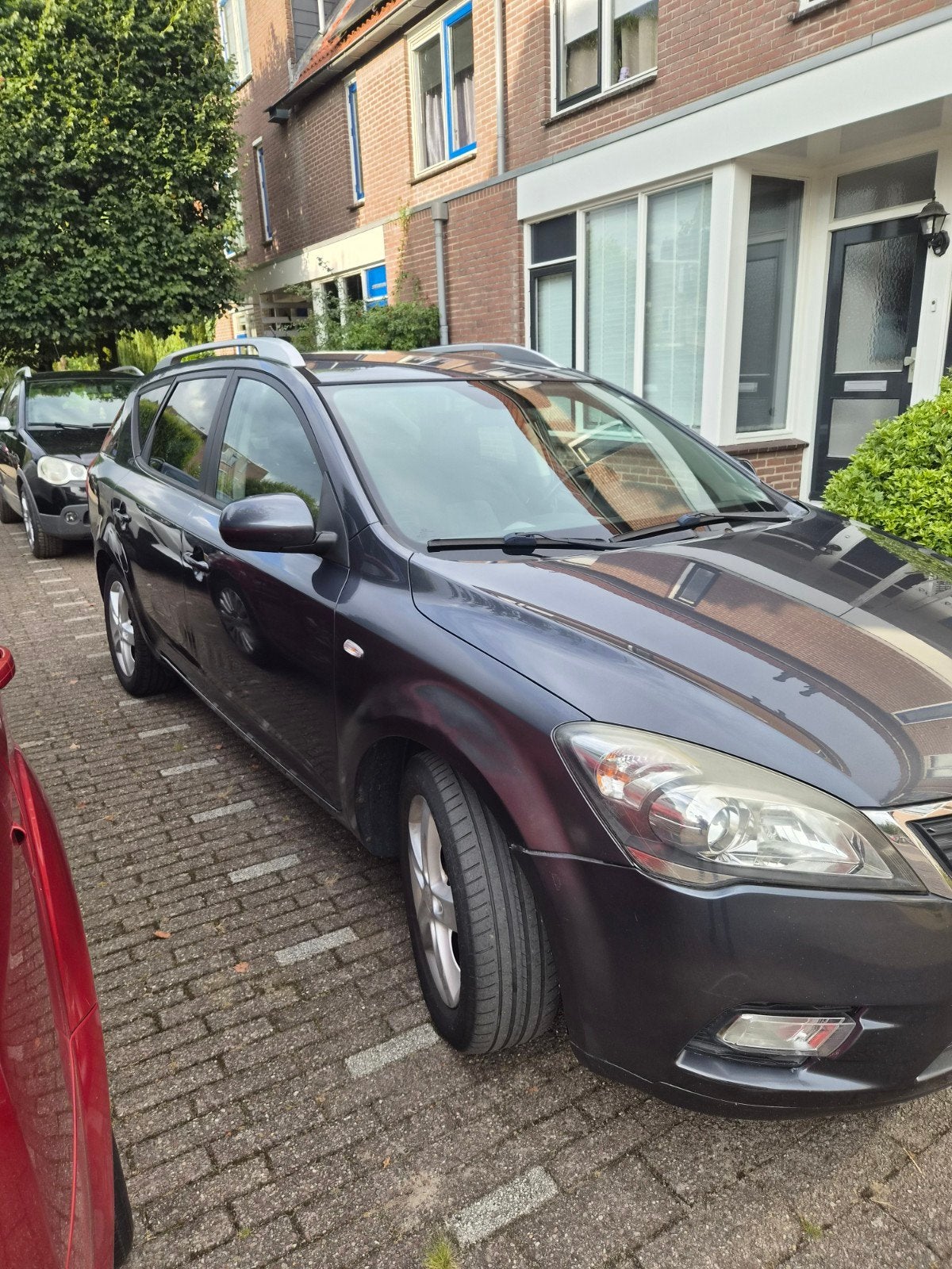 Kia (Pro) Cee d 1.4 Sporty Wagon 2010 Grijs, Auto's, Stof, 4 cilinders, 1396 cc, Origineel Nederlands