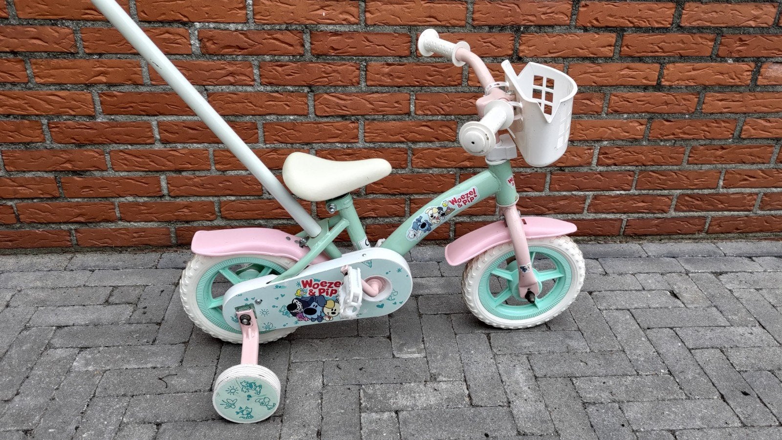 Kinderfiets 10 inch met Duwstang en Zijwieltjes, Woezel, Ophalen, Zo goed als nieuw, Minder dan 16 inch, Zijwieltjes