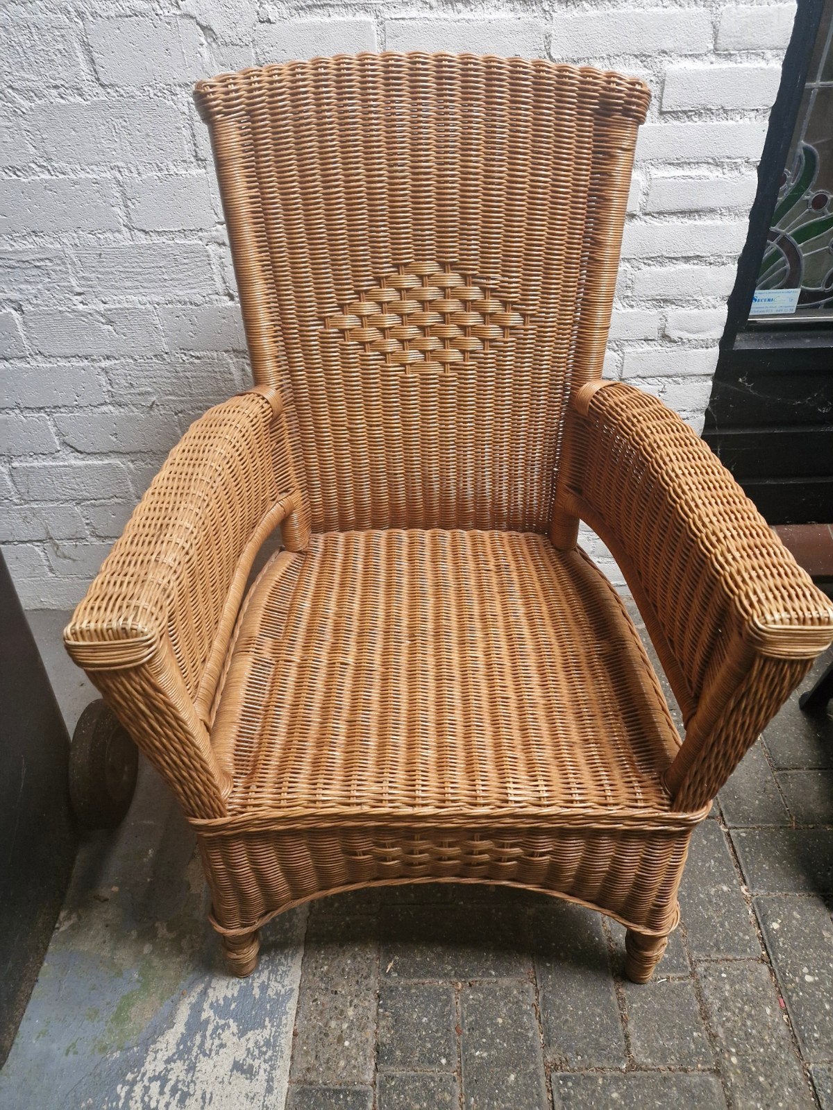 Vintage rotan stoel met armleuningen, Huis en Inrichting, Stoelen, Ophalen, Gebruikt, Bruin, Riet of Rotan
