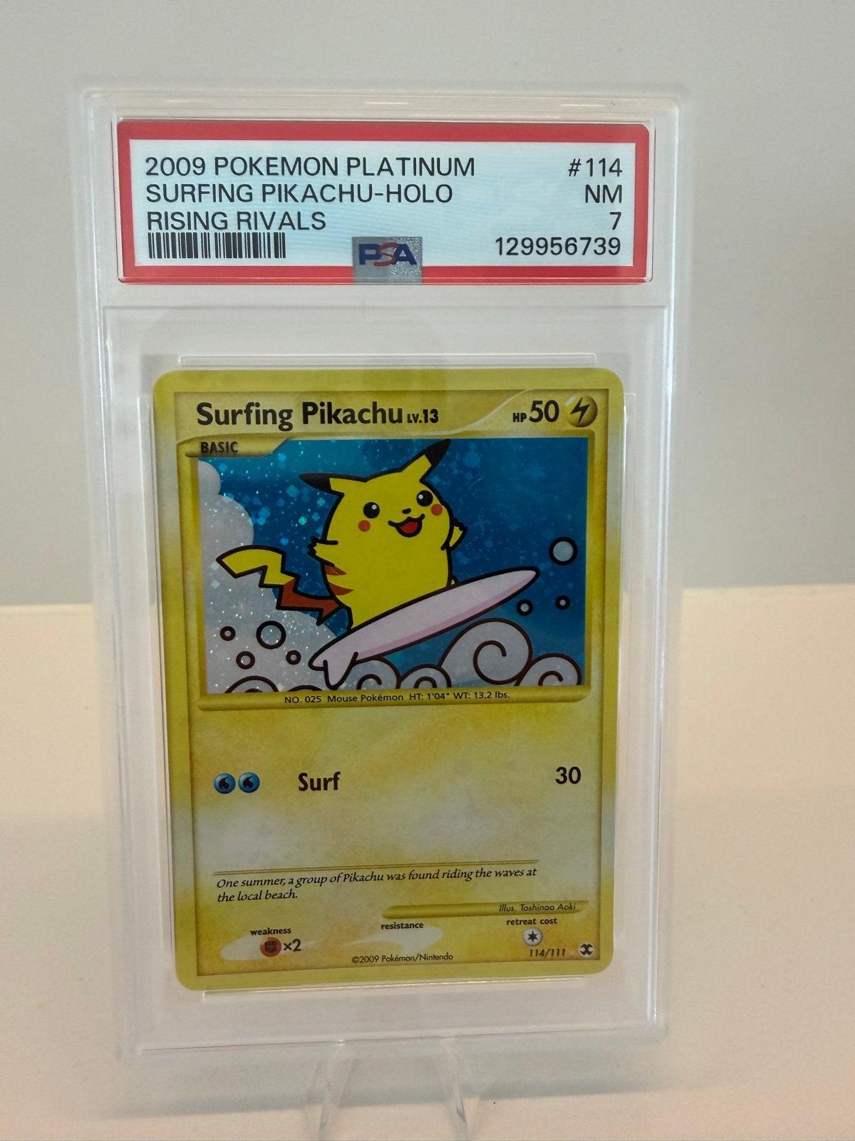 2009 Pokemon Platinum Surfing Pikachu Holo PSA 7, Ophalen of Verzenden, Gebruikt, Losse kaart, Foil