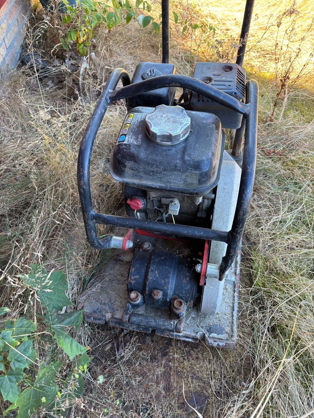 Trilplaat JCB 90 / trekkoort erbij moet opgerold worden, Ophalen