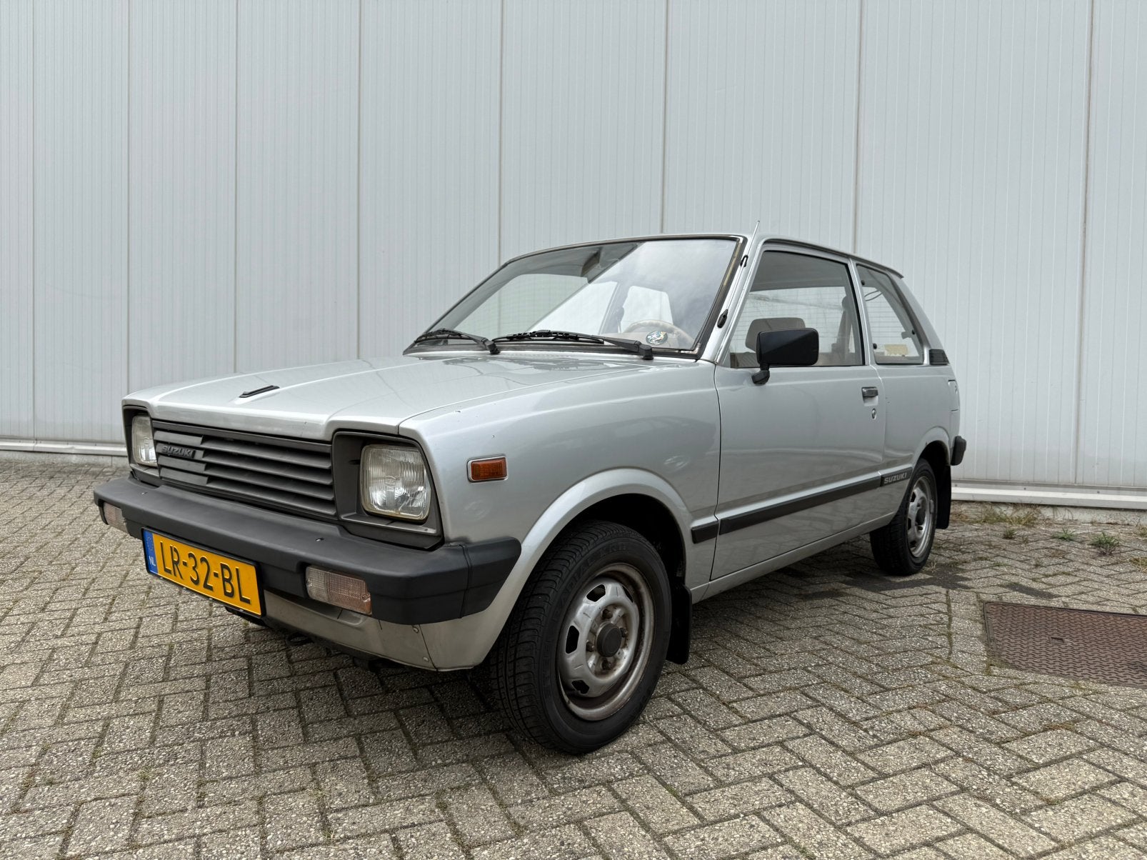 Suzuki Alto 0.8 AUT 1984 Grijs, Stof, Beige, 620 kg, Particulier