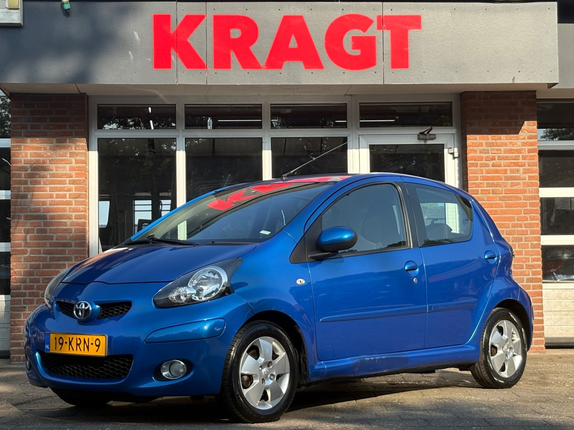Toyota Aygo Dynamic Blue 1.0-12V - AUTOMAAT - Airco - lichtm, Stof, Gebruikt, Zwart, 68 pk