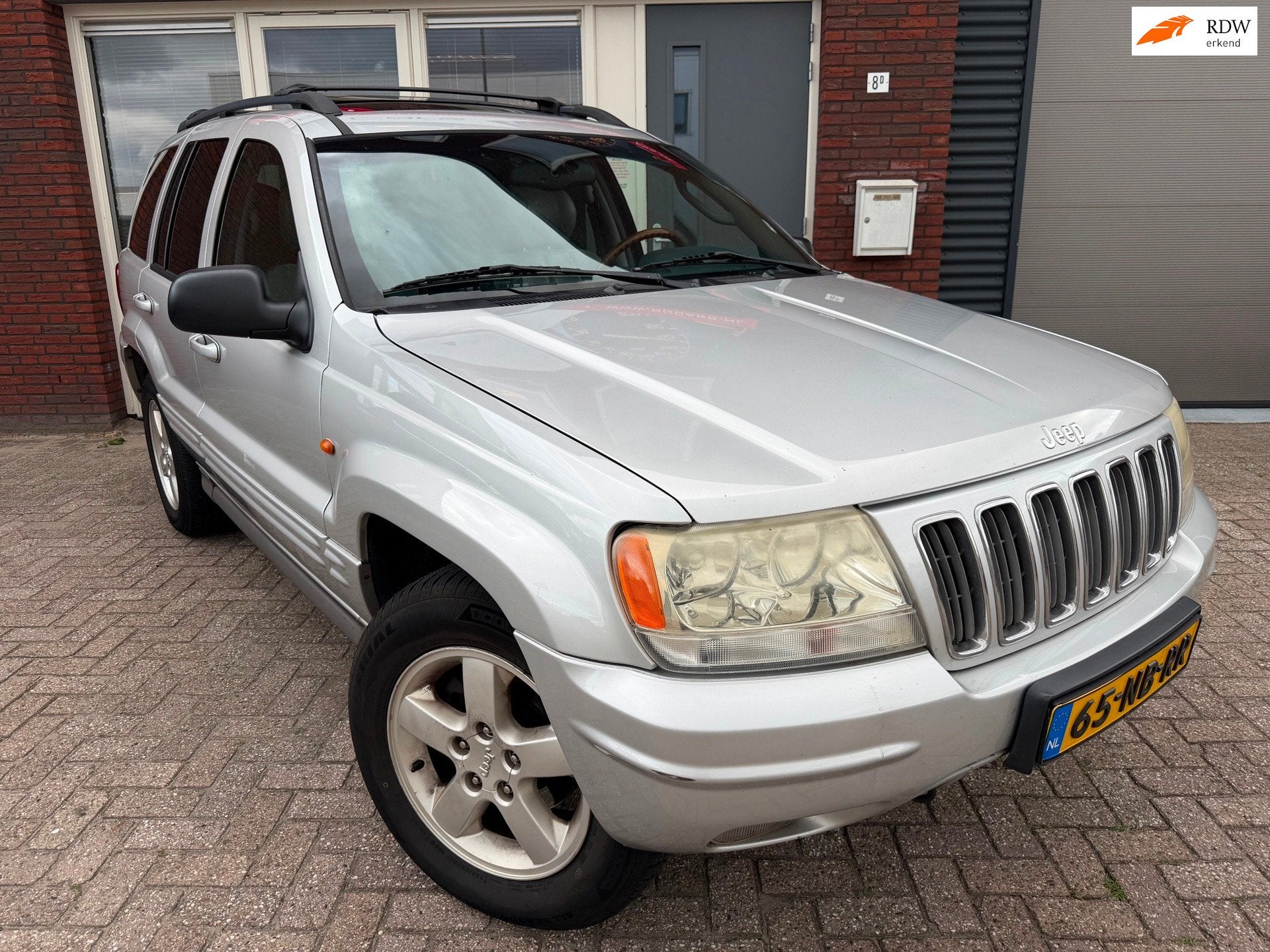 Jeep Grand Cherokee 4.7i V8 Overland High Output / Pano / Le, Auto's, Automaat, Gebruikt, Met garantie (alle), 1969 kg