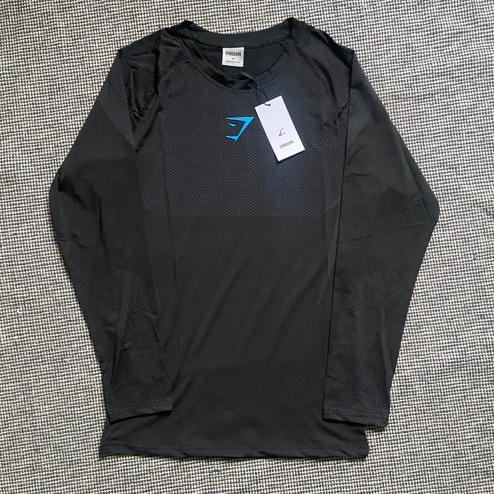 Gymshark Onyx V5 Longsleeve Zwart met Blauw Logo Maat M Nieu, Fitness, Maat 48/50 (M), Zwart, Nieuw